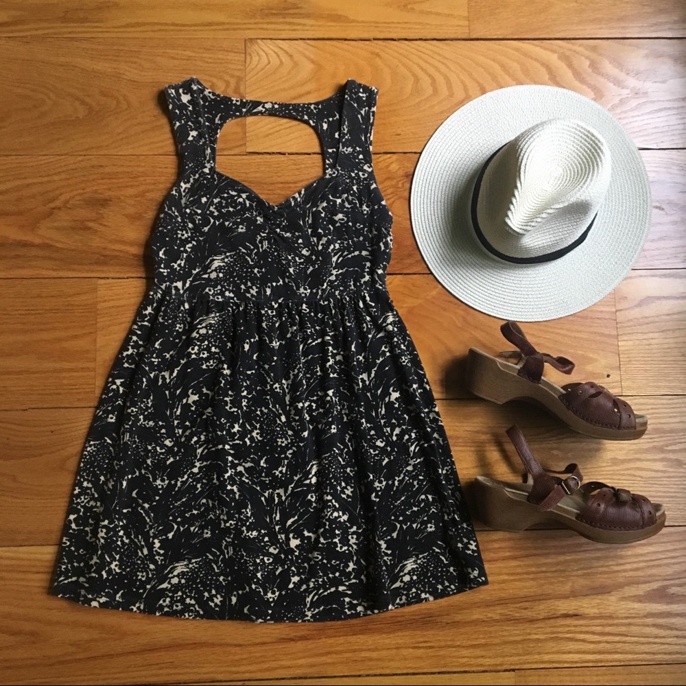 Black and cream open back knit dress
